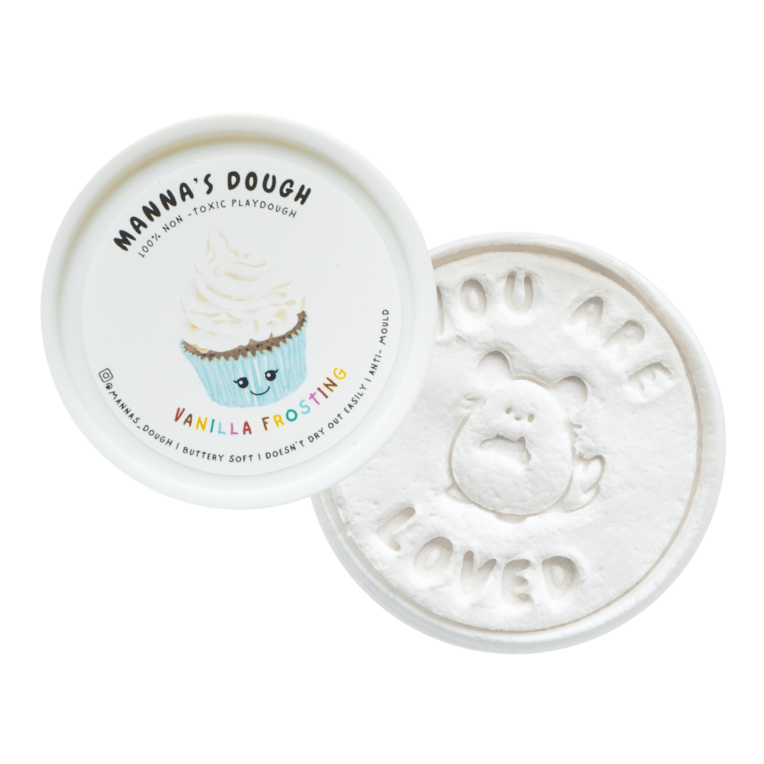 A pot of white playdough with a cupcake design and the text 'You are loved' on the lid.