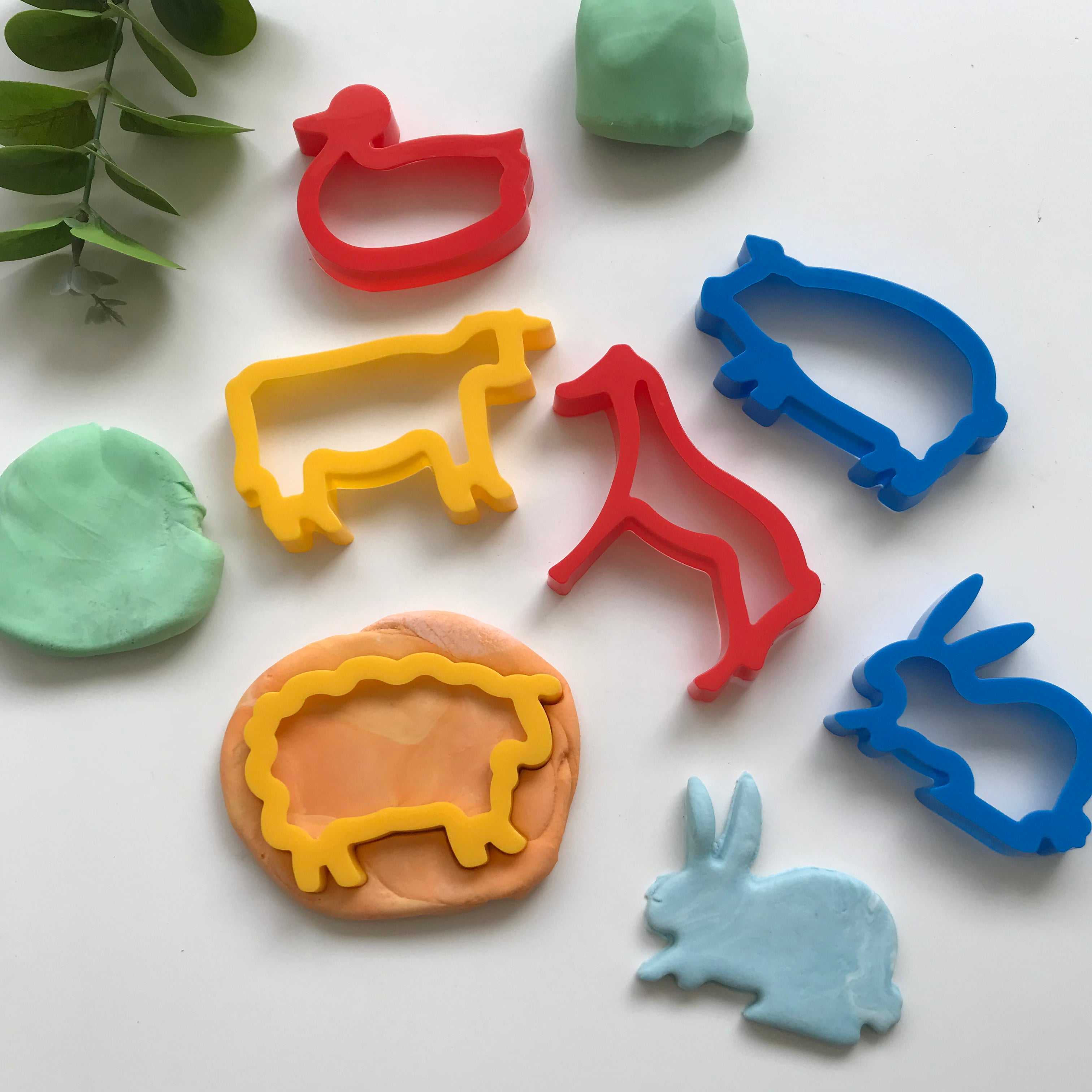 Set of Farm playdough cutters and some playdough creations. The cutter deisngs are a cow, duck, horse, pig, bunny and sheep