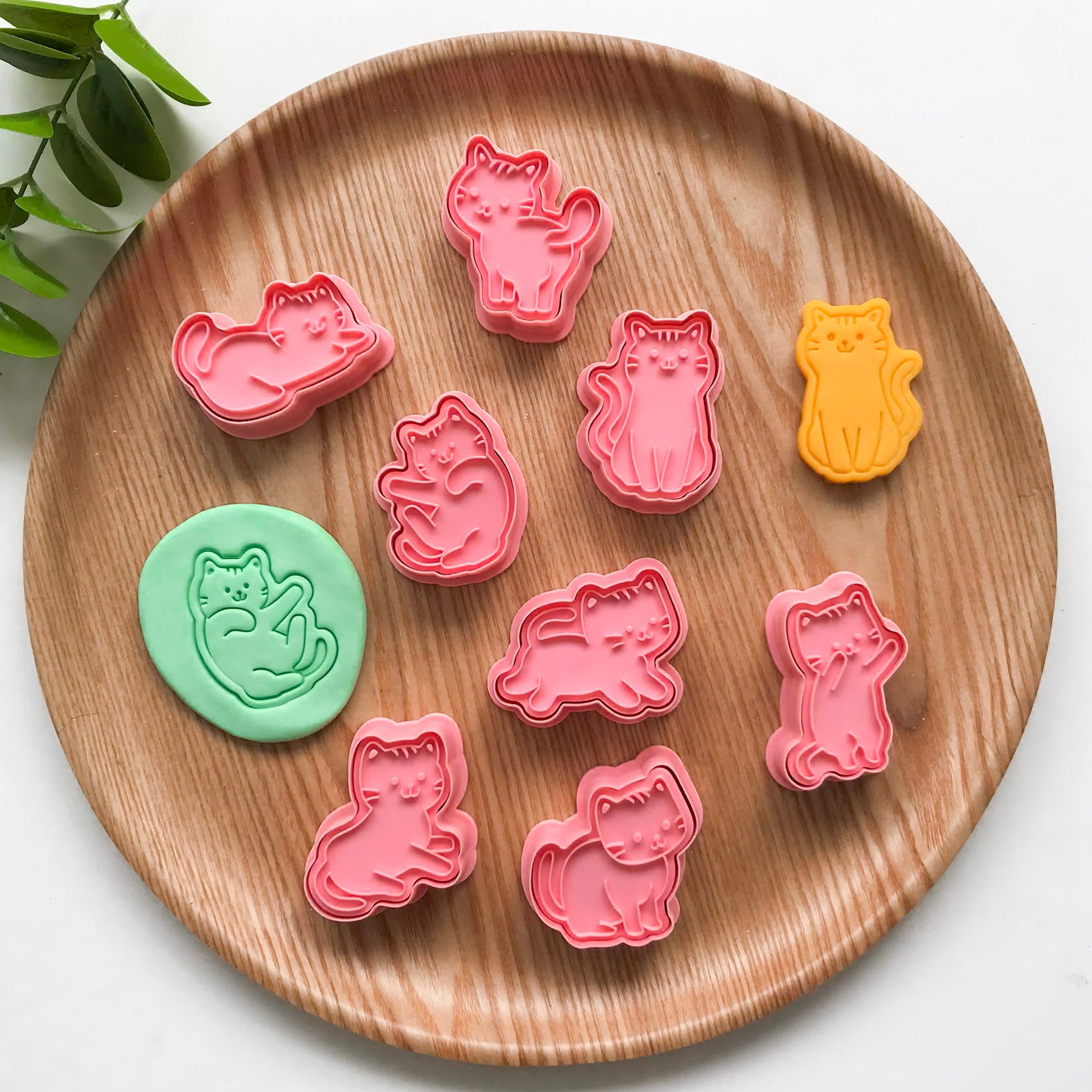A set of 8 playdough cutters featuring kitty cats in different poses
