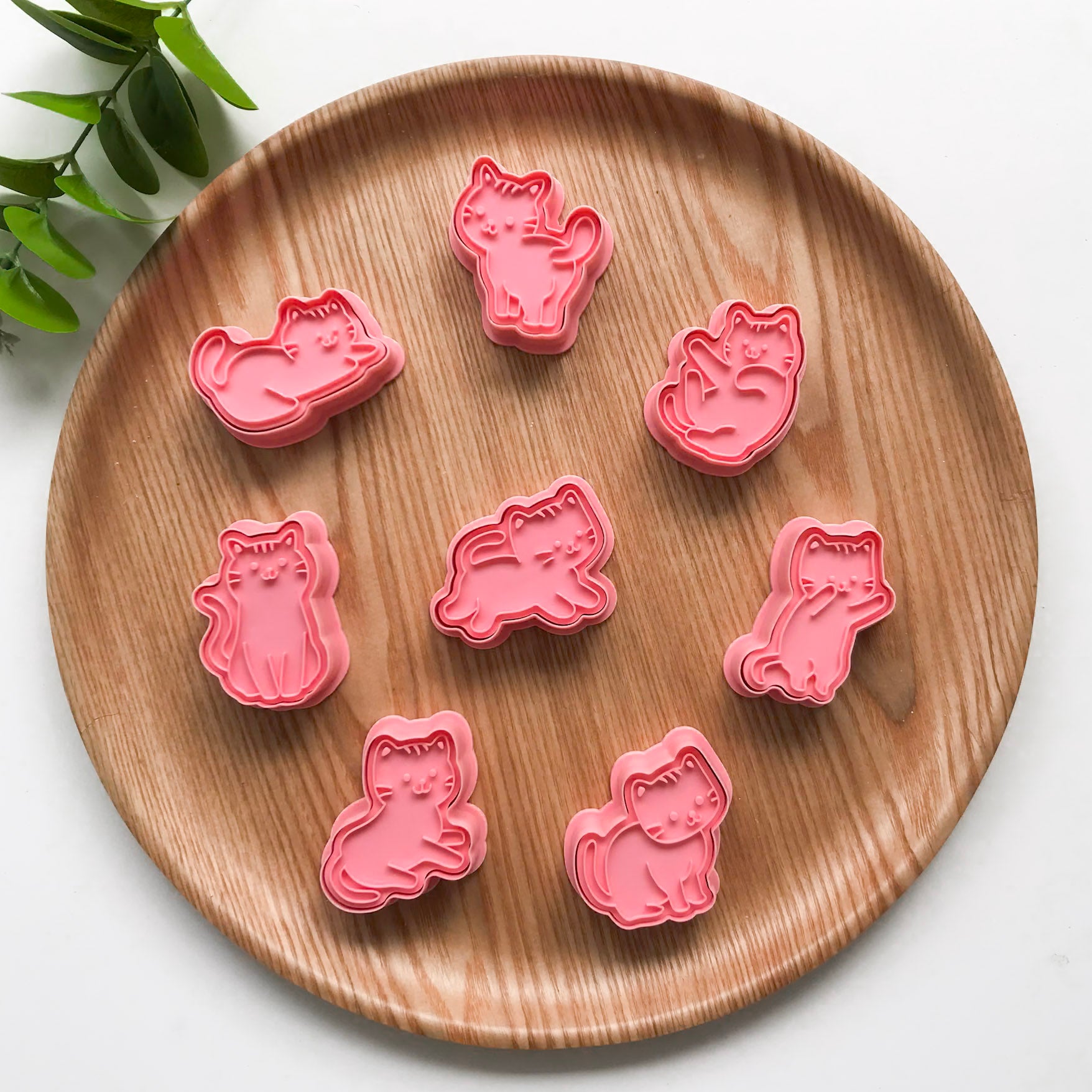 A set of 8 playdough cutters featuring kitty cats in different poses