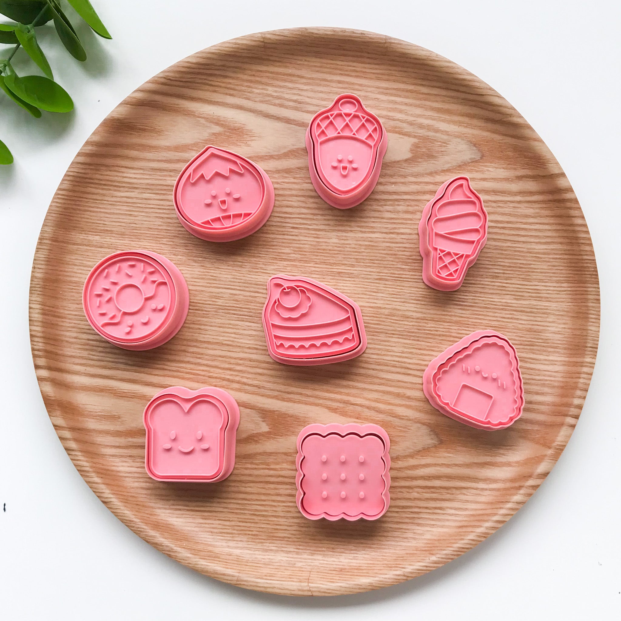 A set of 8 snack themed playdough cutters featuring different foods such as donut, toast, biscuit, cake, bao, acorn, ice cream and onigiri