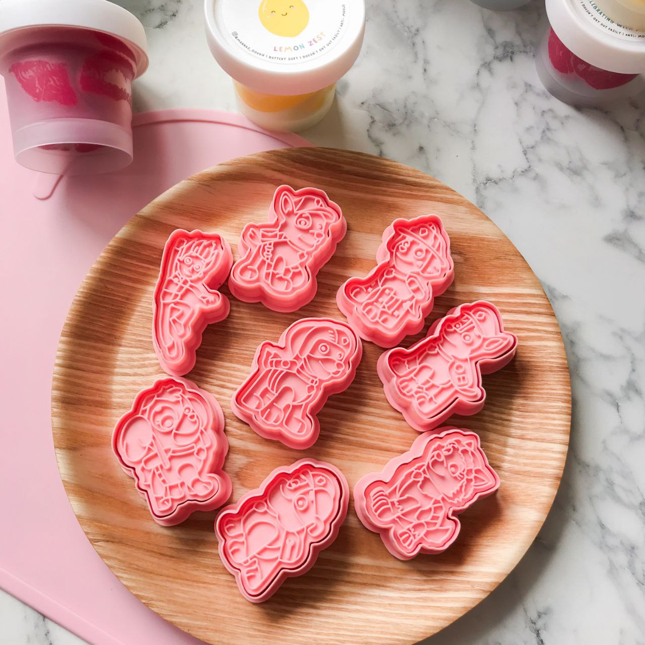 A set of 8 paw patrol themed cutters featured on a brown display plate