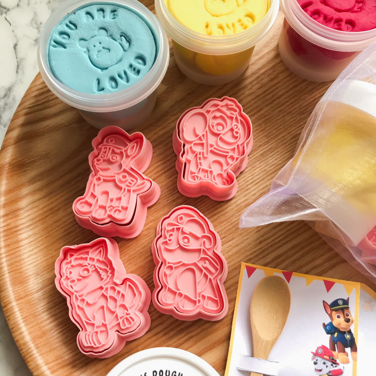 A set of 4 paw patrol playdough cutters